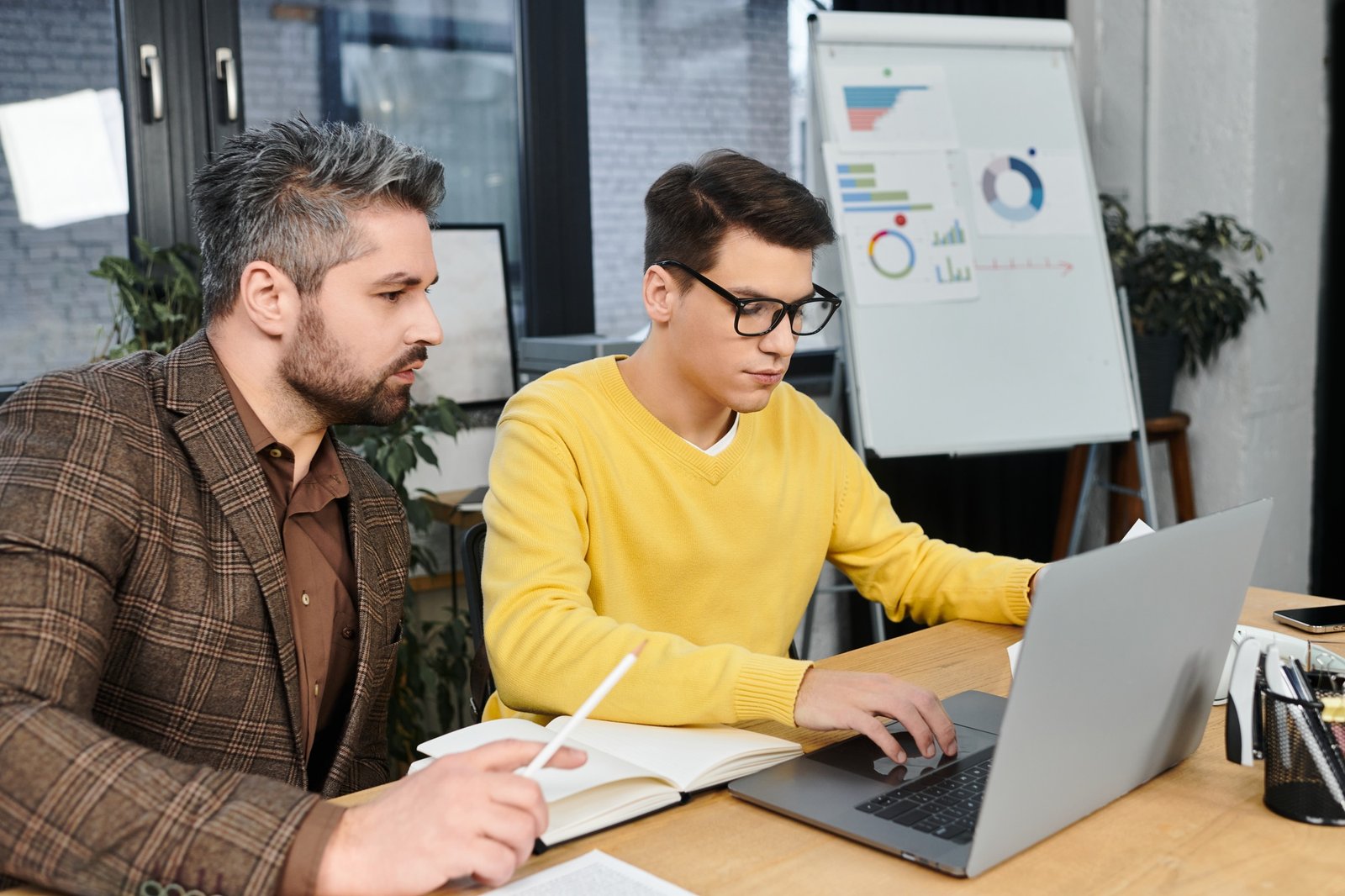 Guiding a new employee through the onboarding process in a modern office environment