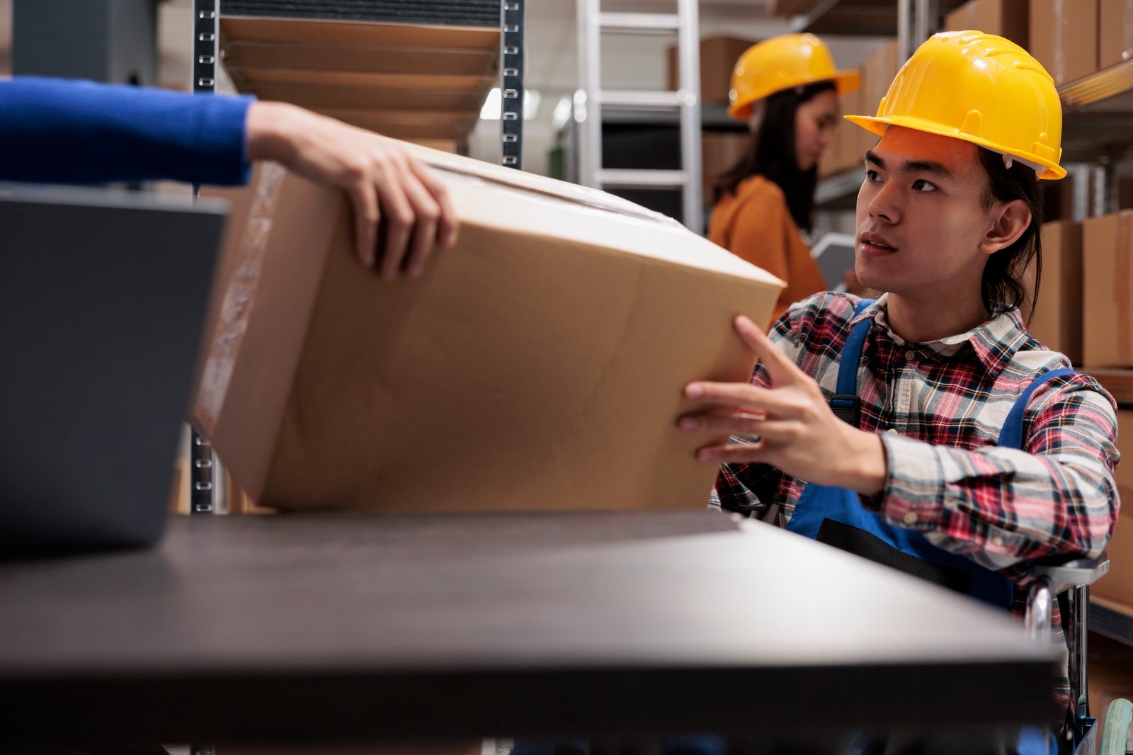 Storehouse order picker in wheelchair doing order fulfillment